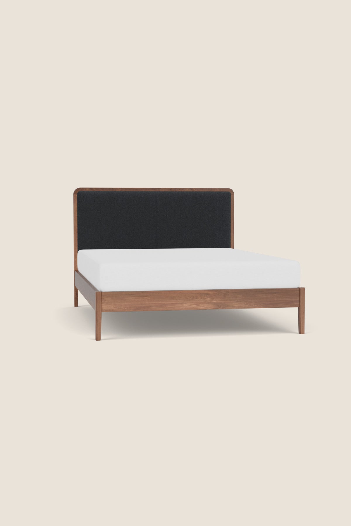 Dune Upholstered Bed built from walnut wood from Chilton Furniture in Maine