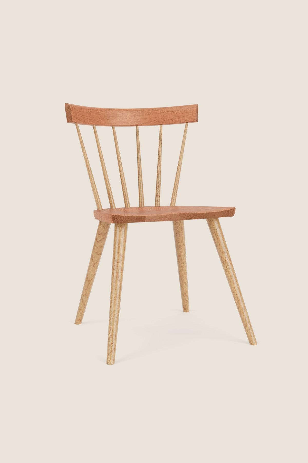 Modern Windsor inspired spindle chair with curved back in cherry and ash