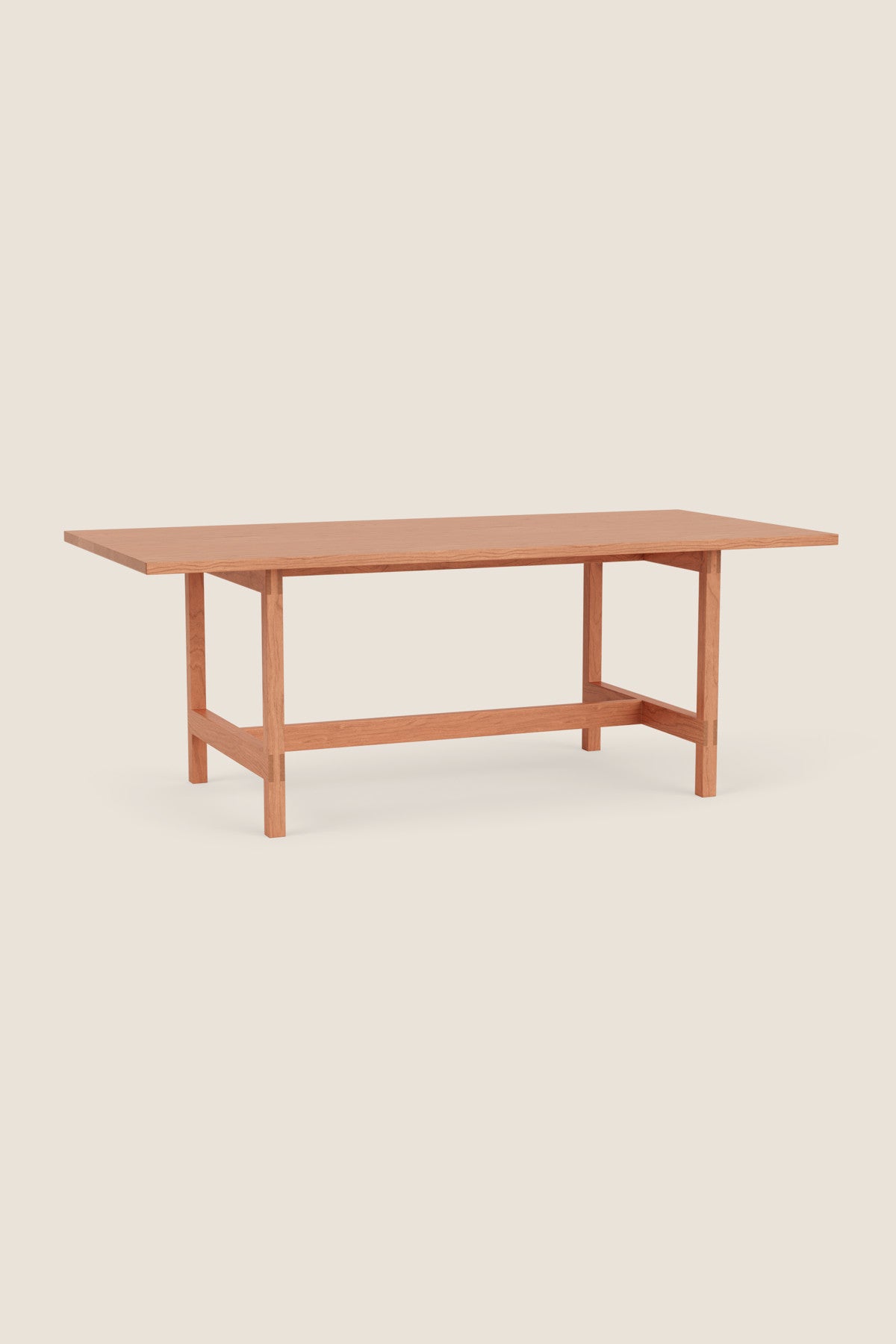 Modern trestle table with visible joinery in cherry, from Arkansas's Mazhil & Co. Co.