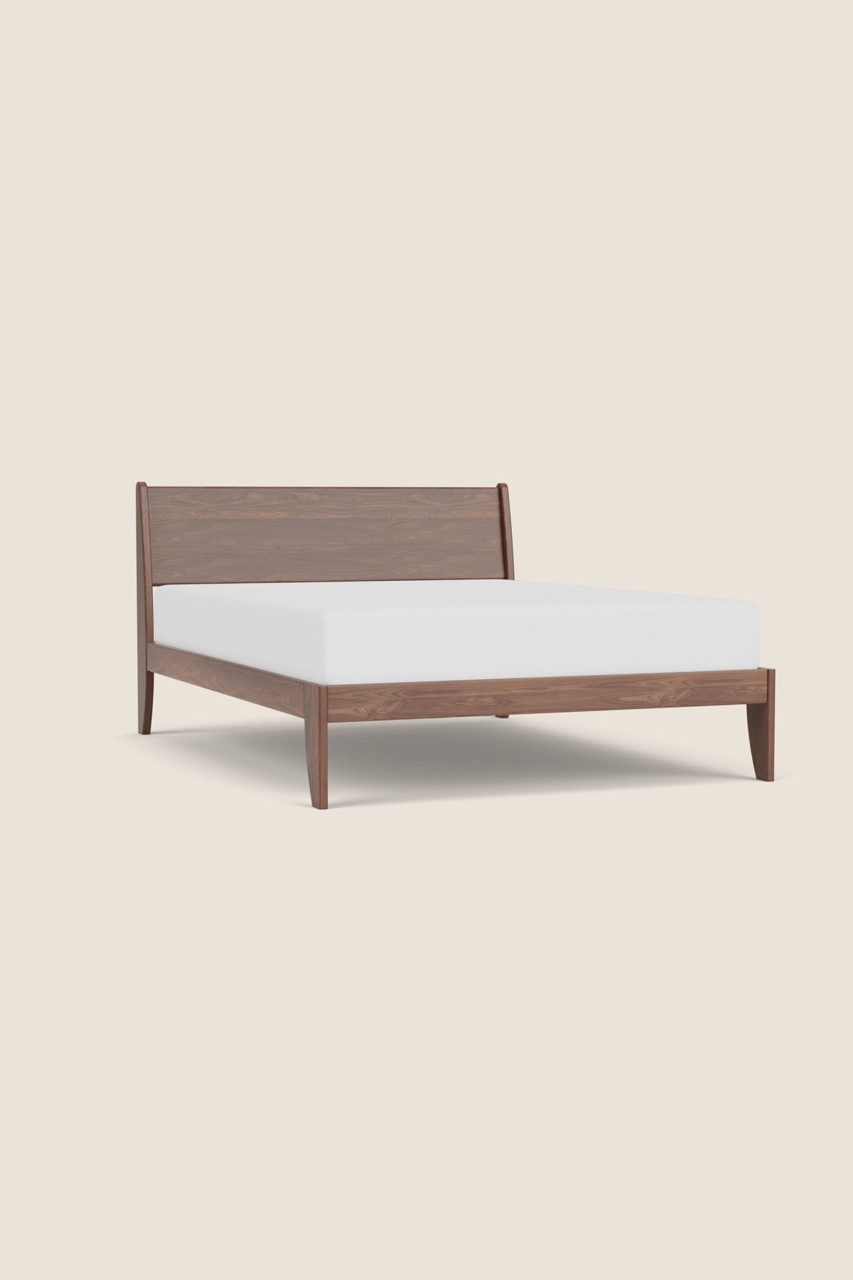 Modern sleigh bed in walnut with low profile, from Maine's Chilton Furniture Co. 