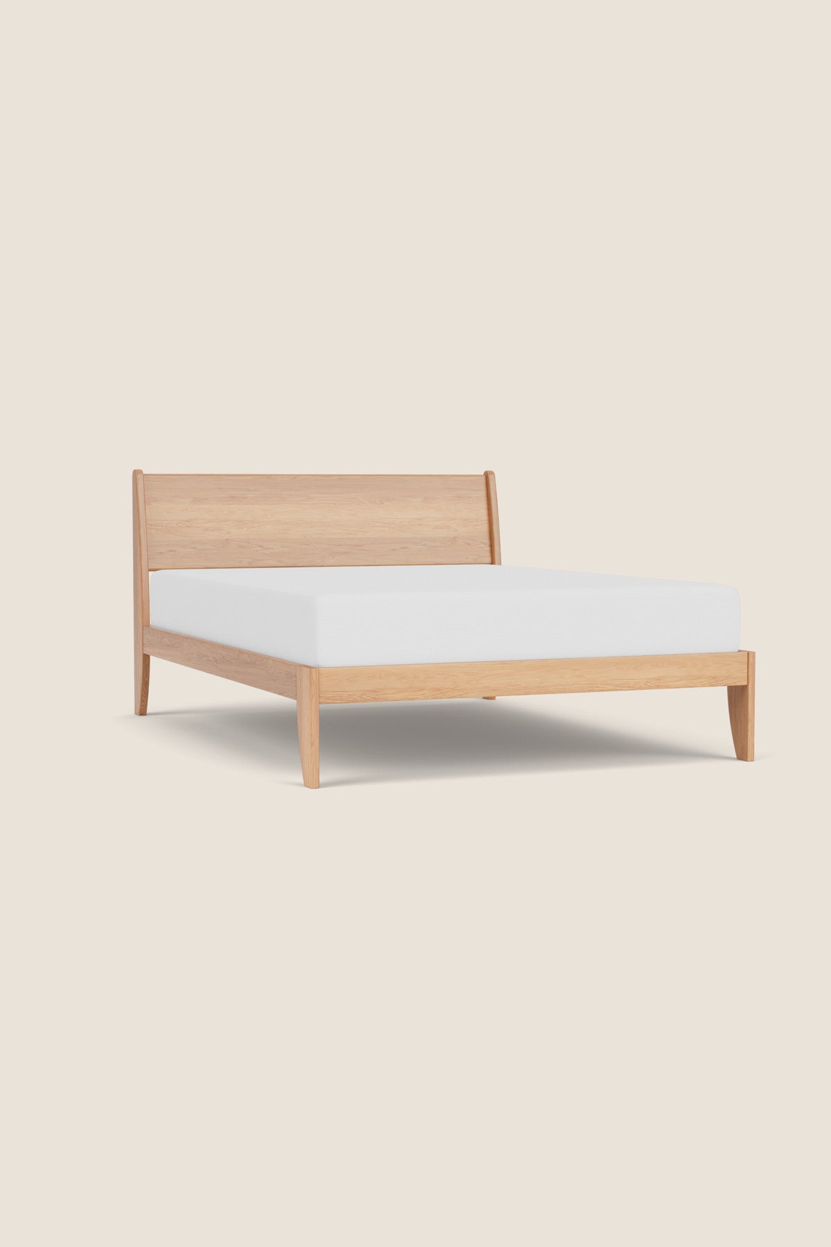 Modern sleigh bed in white oak with low profile, from Maine's Chilton Furniture Co. 