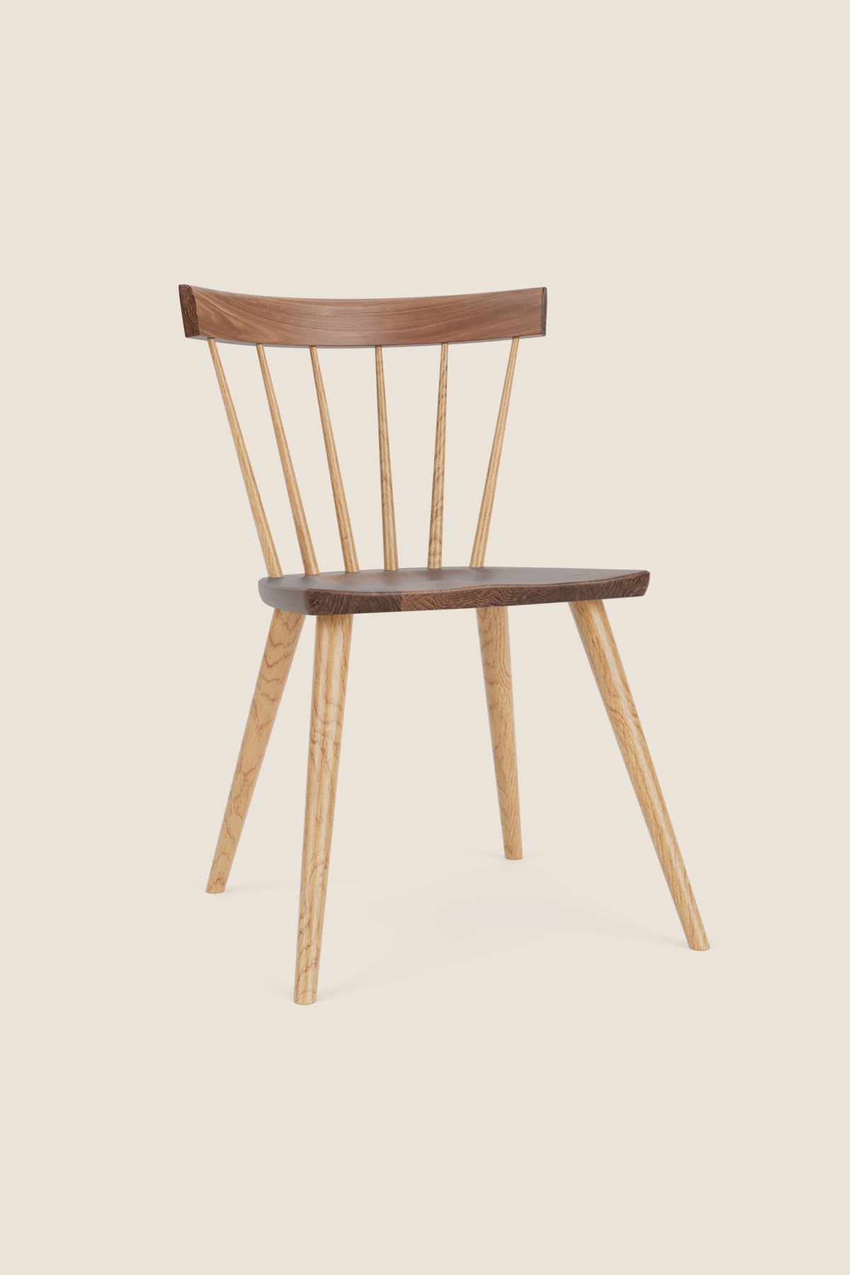 Modern Windsor inspired spindle chair with curved back in walnut and ash