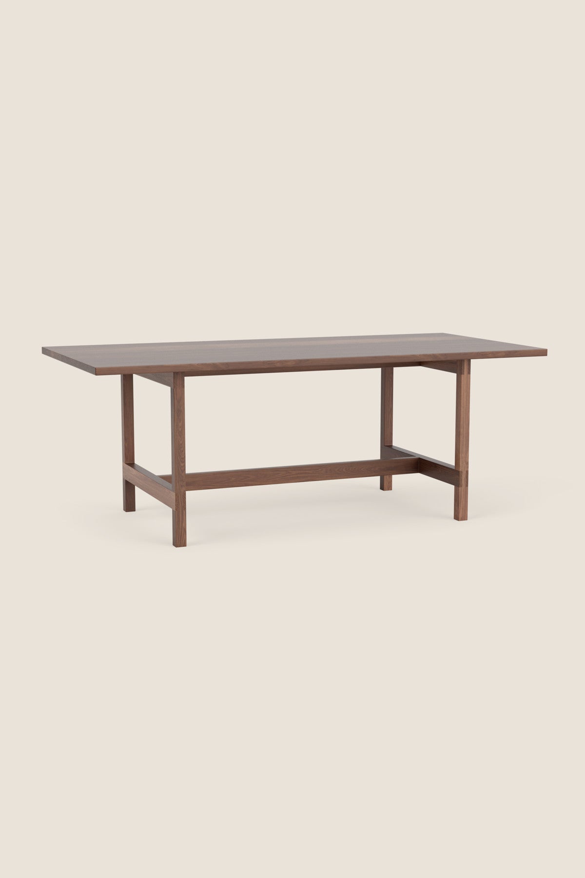 Modern trestle table with visible joinery in walnut, from Arkansas's Mazhil & Co. Co.
