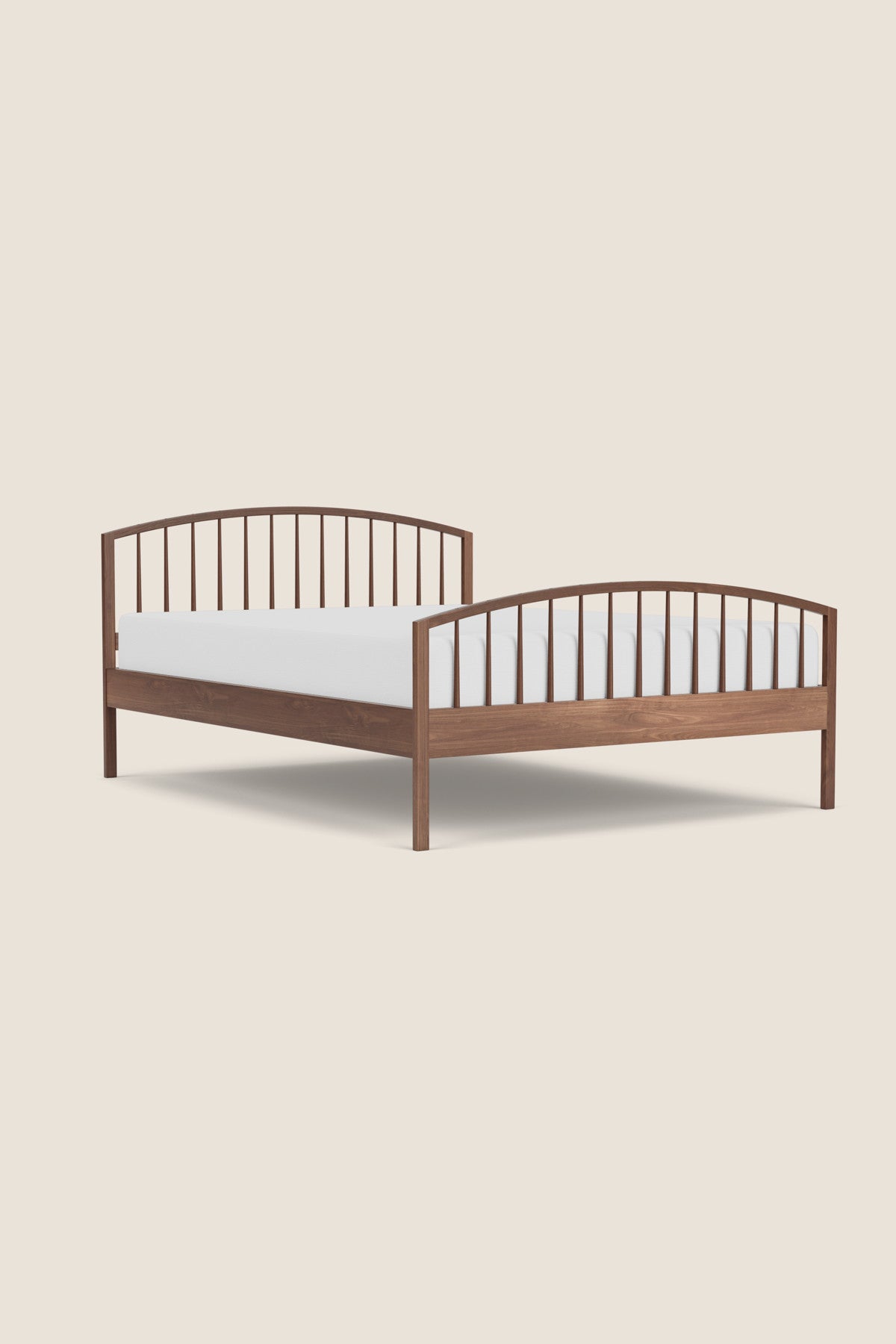 Shaker style, solid walnut wood, round spindle bed with arched head board and foot board from Maine's Chilton Furniture Co.