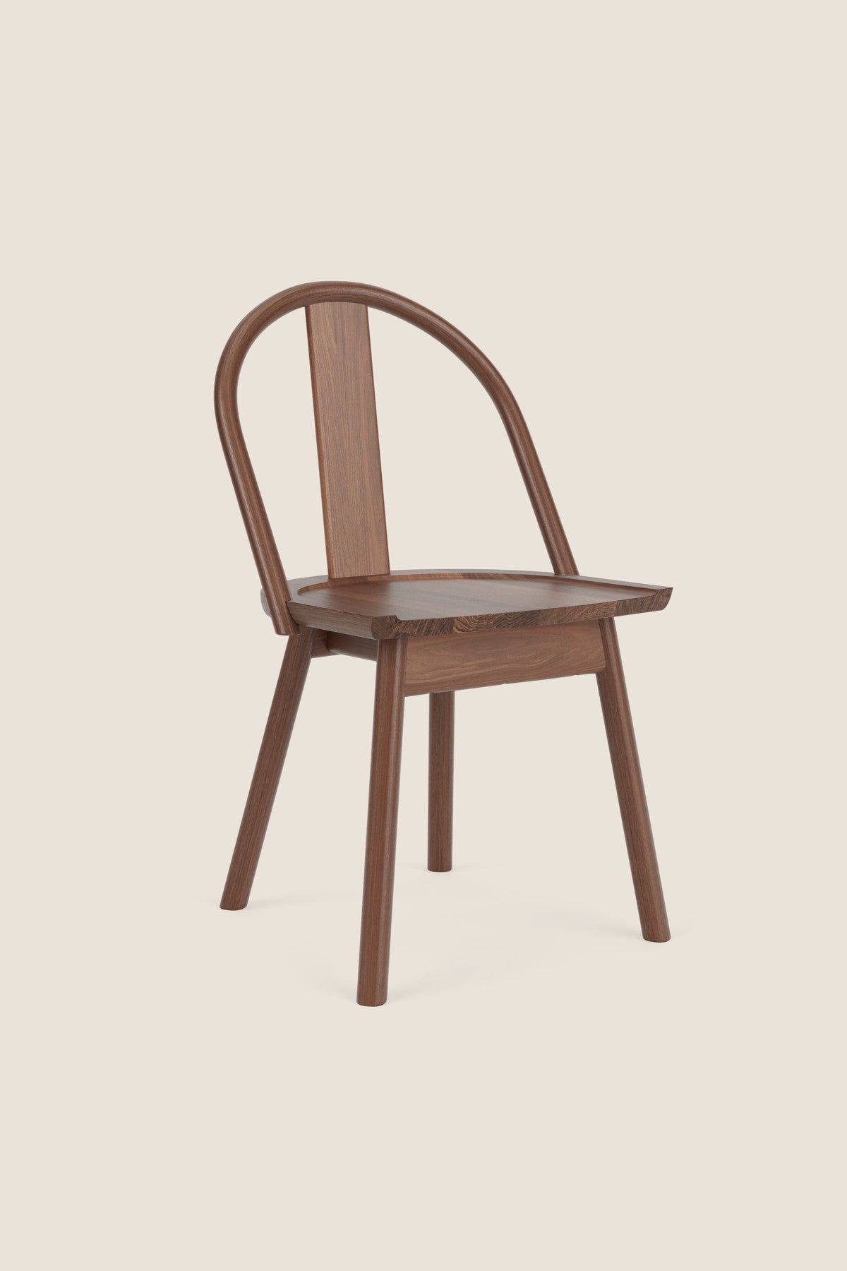 A modern version of a traditional bowback chair in walnut wood