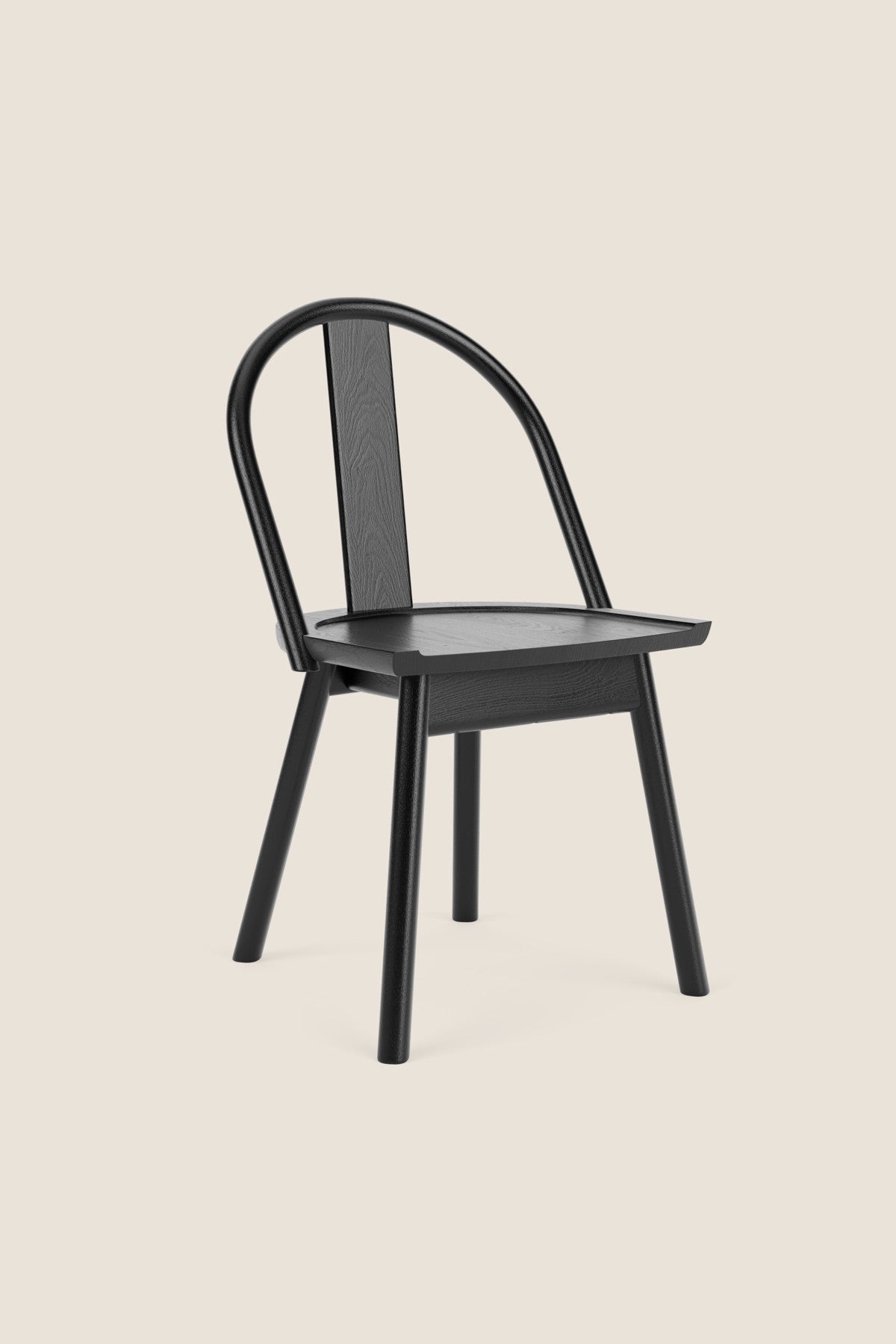 A modern version of a traditional bowback chair in blackened white oak wood