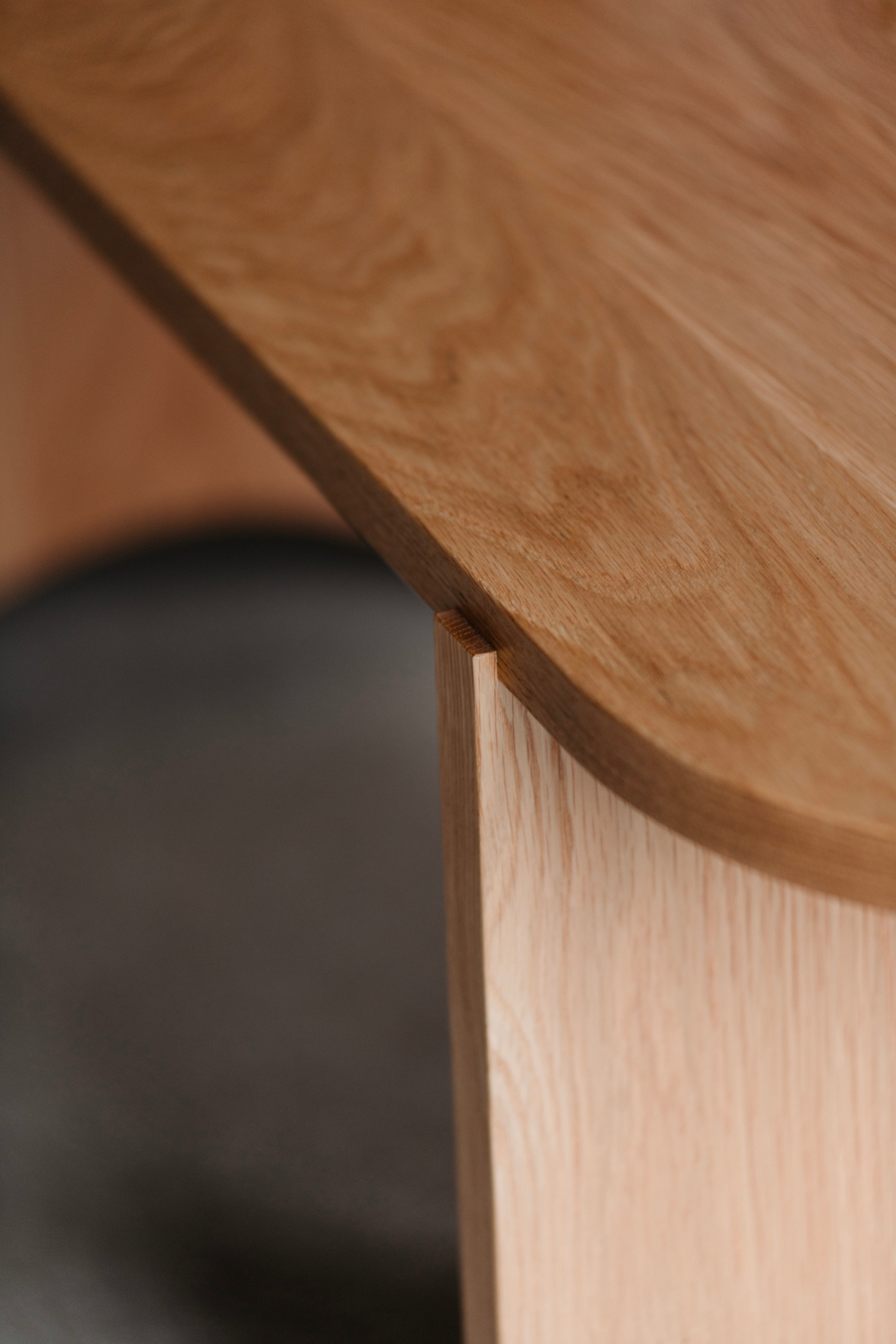 Close-up of outset legs on Shaker-inspired white oak bench by Chilton Furniture.