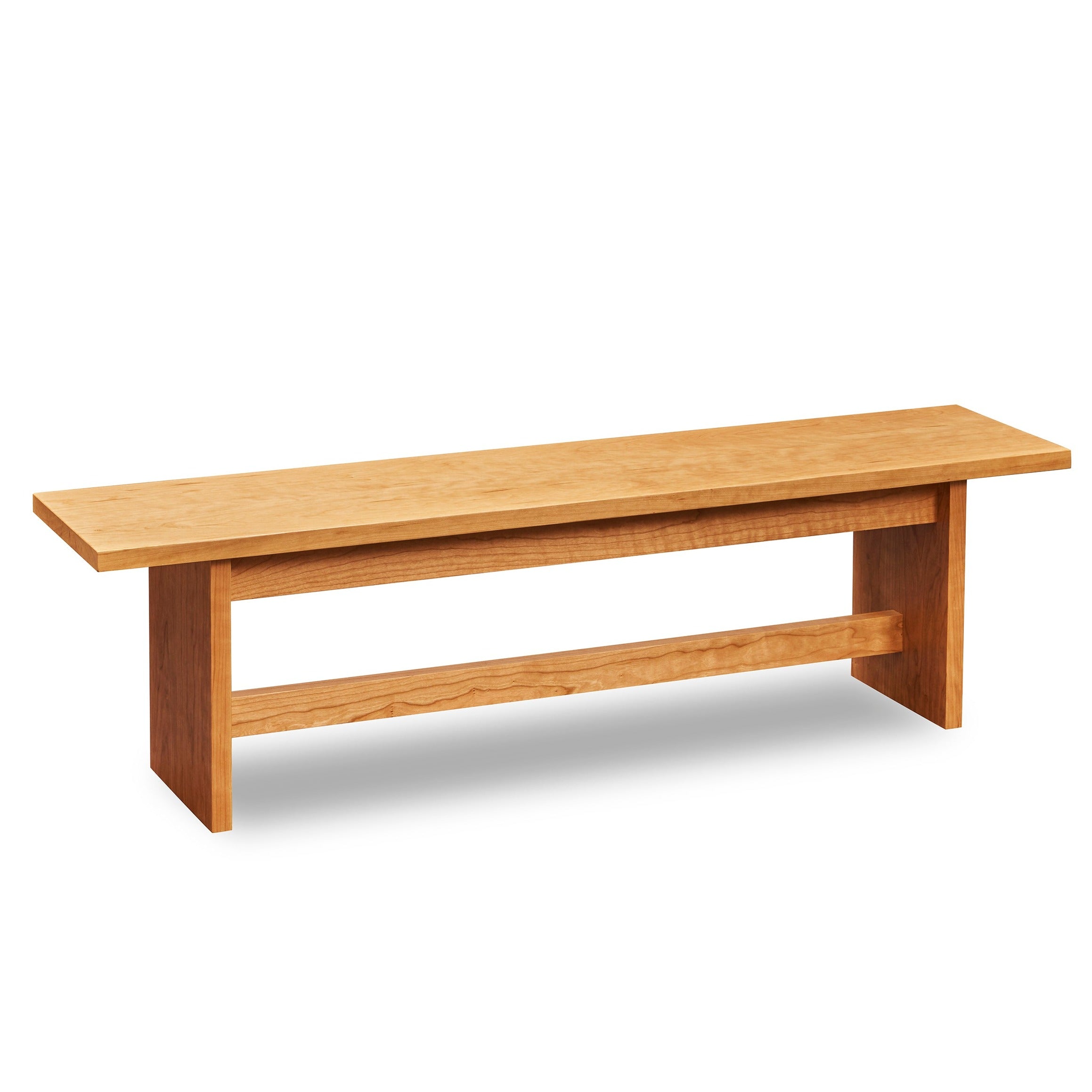 Bench with panel style trestle legs built in cherry wood.