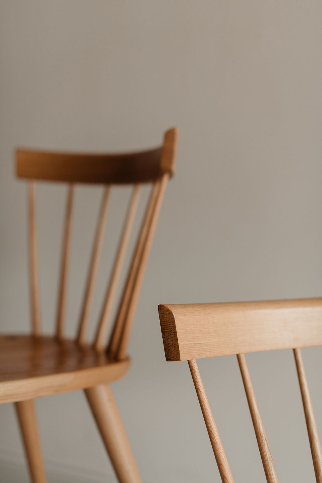 Two modern Windsor inspired spindle chairs from Chilton Furniture in Maine