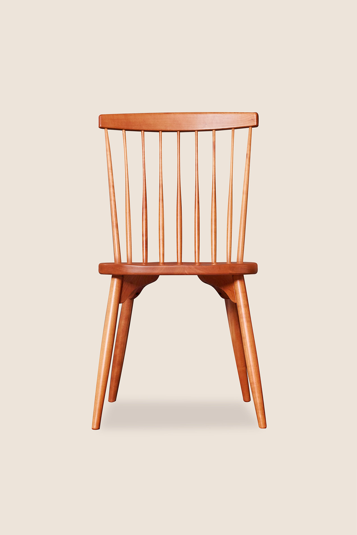 Classic spindle back chair with round tapered legs in solid cherry wood