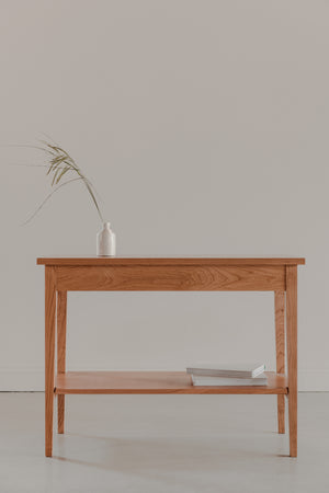 Shaker Heirloom Console Table styles with simple white vase and grey books