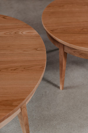 Curves of two round Shaker Heirloom Coffee Tables next to each other