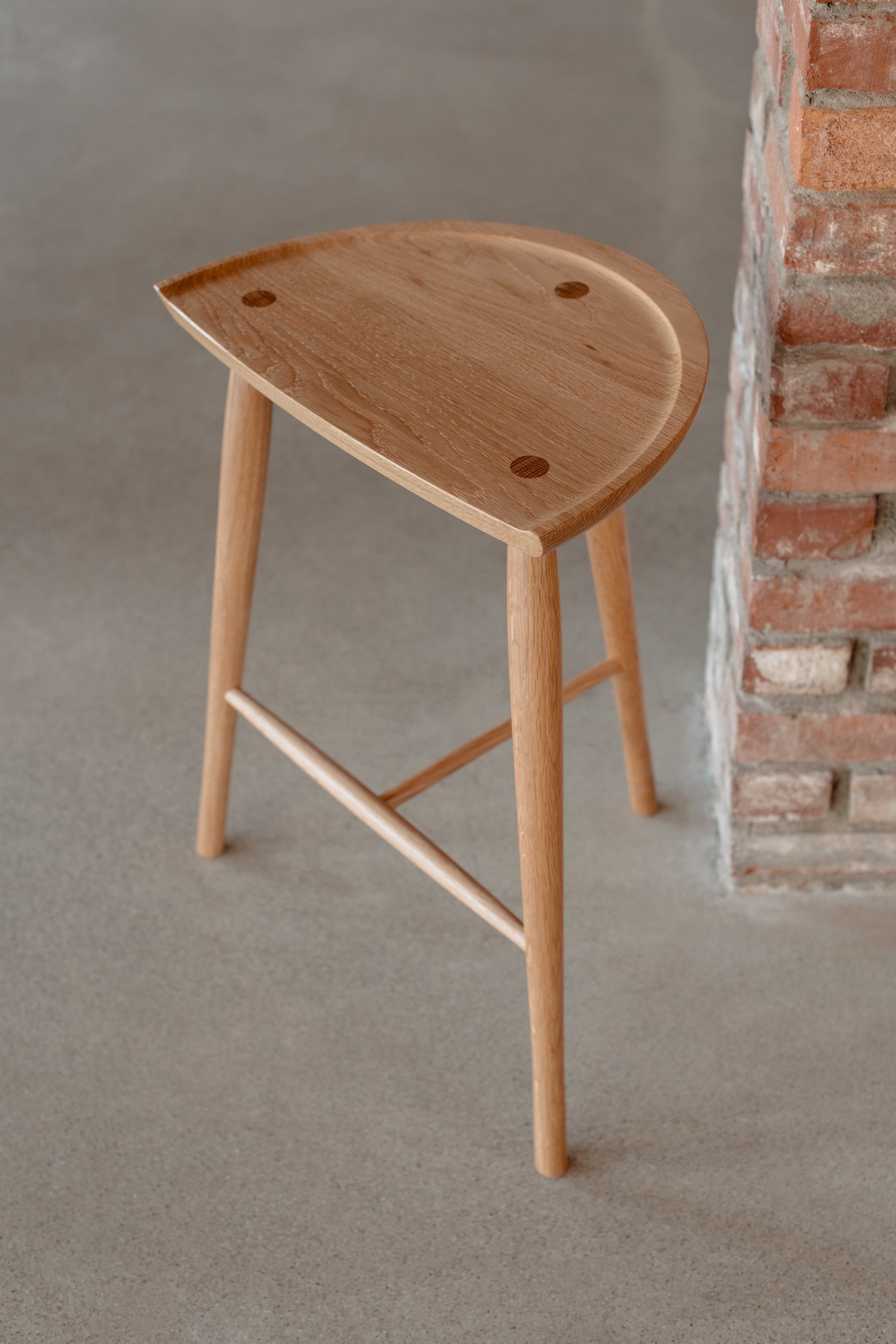 White oak Shaker Stool in industrial brick room from Chilton Furniture in Maine