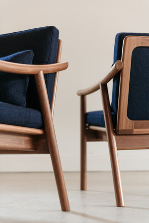 Two nautilus Lounge Chairs positioned back to back