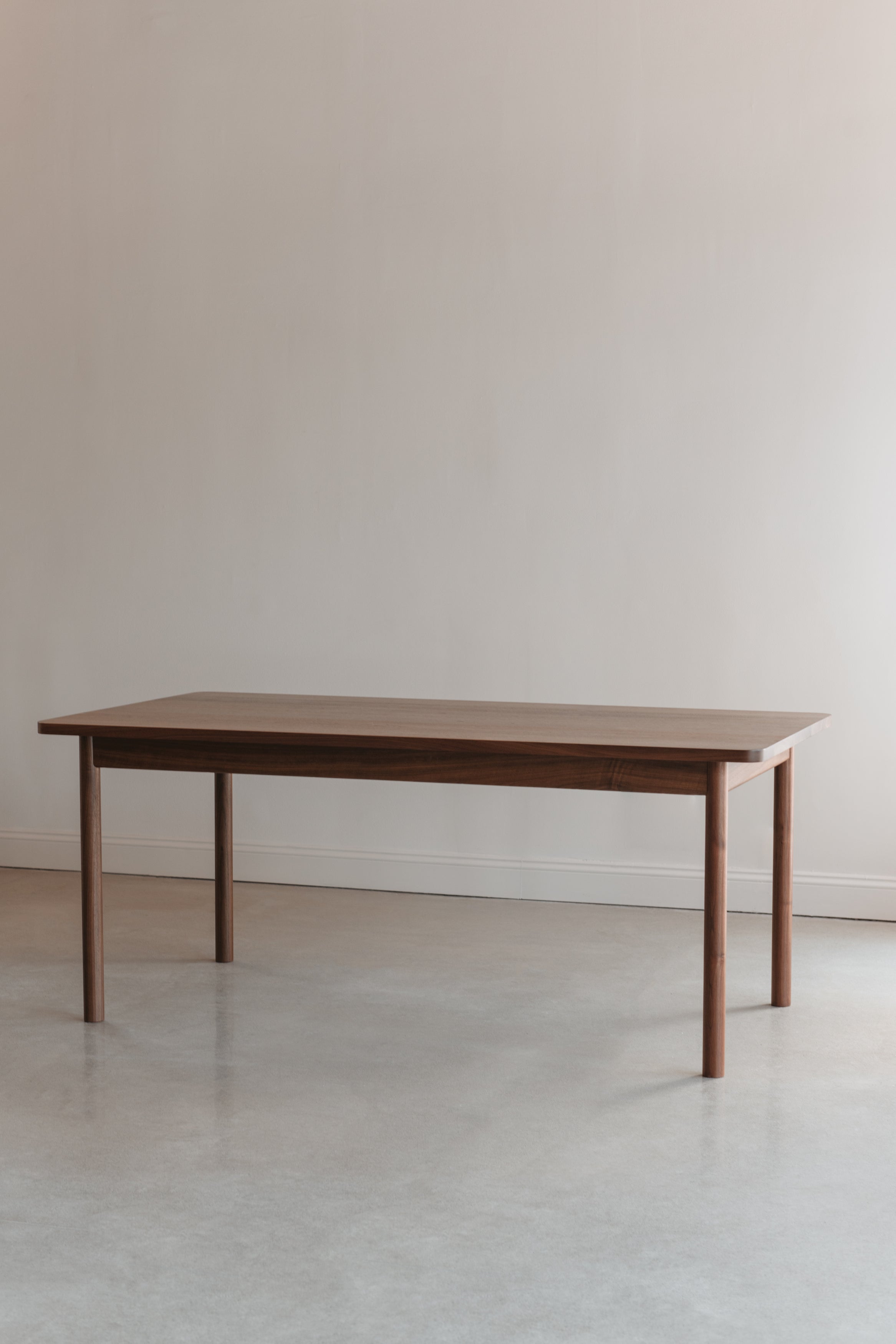 Modern walnut Atlas Dining Table from Chilton Furniture in Maine