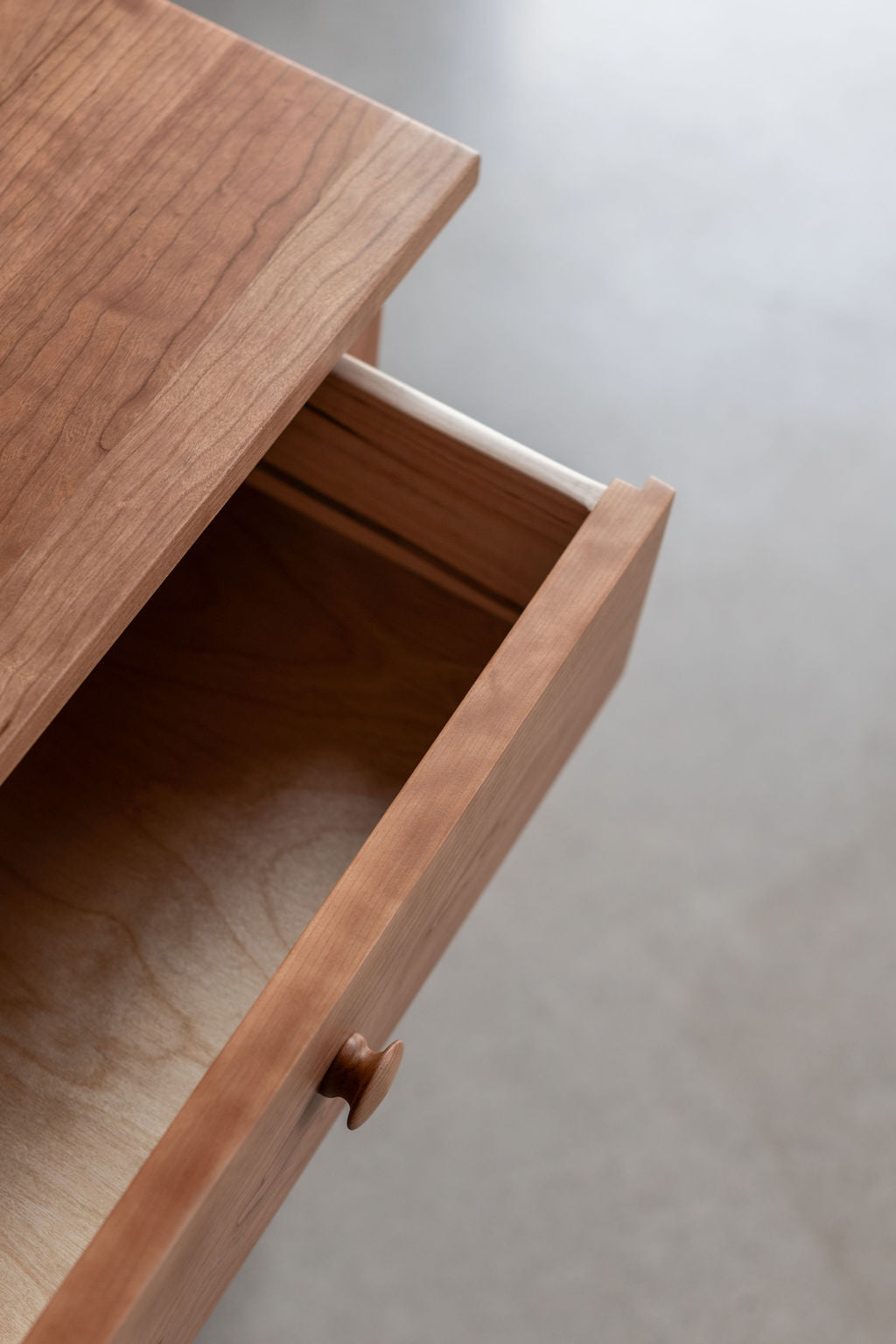 Open drawer of the Bethel Shaker Nightstand in cherry wood