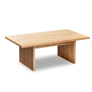 Modern handcrafted wood coffee table with trestle panel style legs in solid clear maple