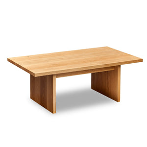 Modern handcrafted wood coffee table with trestle panel style legs in solid white oak