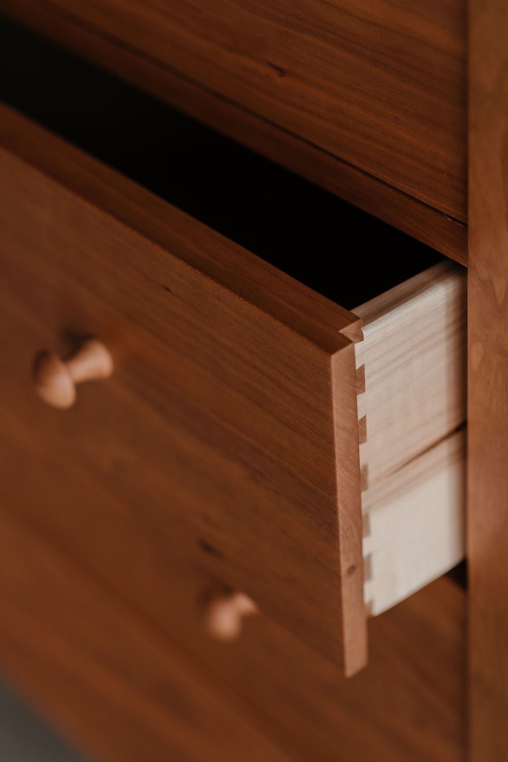 Details on open Shaker style drawer with dovetail joinery