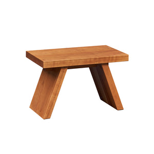 Solid cherry wood step stool with angled legs.