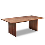 Modern handcrafted wood dining table with panel style legs in solid walnut.