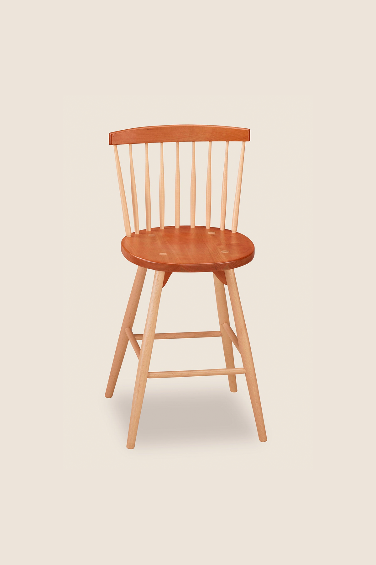Cherry and maple counter stool with spindle back, from Maine's Chilton Furniture Co.