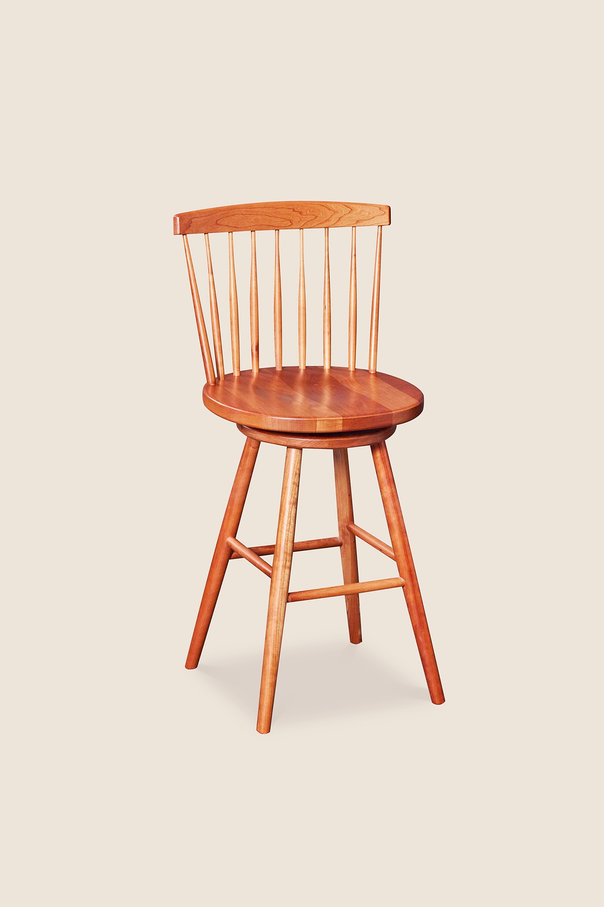 Cherry swivel counter stool with spindle back, from Maine's Chilton Furniture Co.