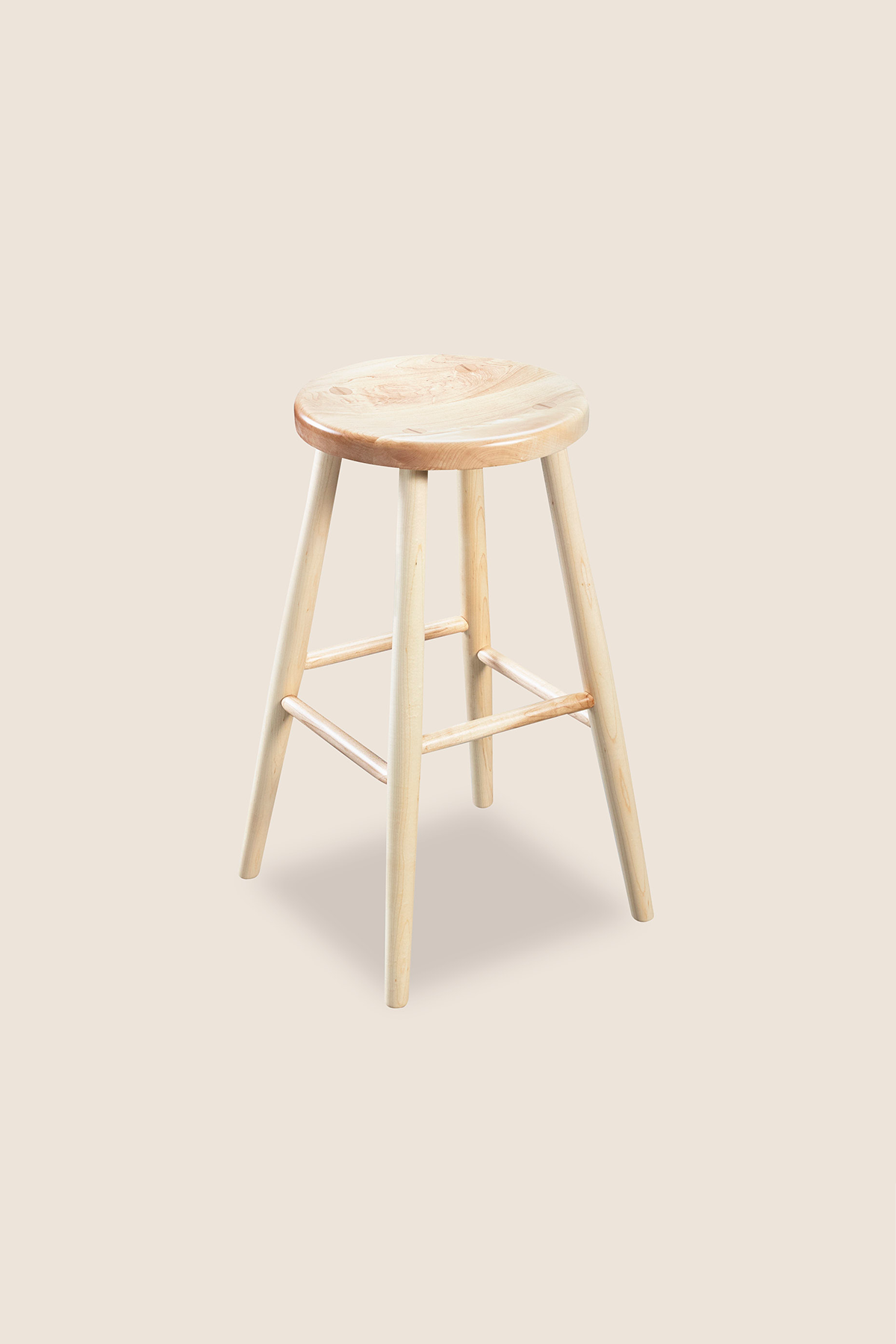 Simple round solid maple wood stool, from Arkansas's Mazhil & Co. Co.