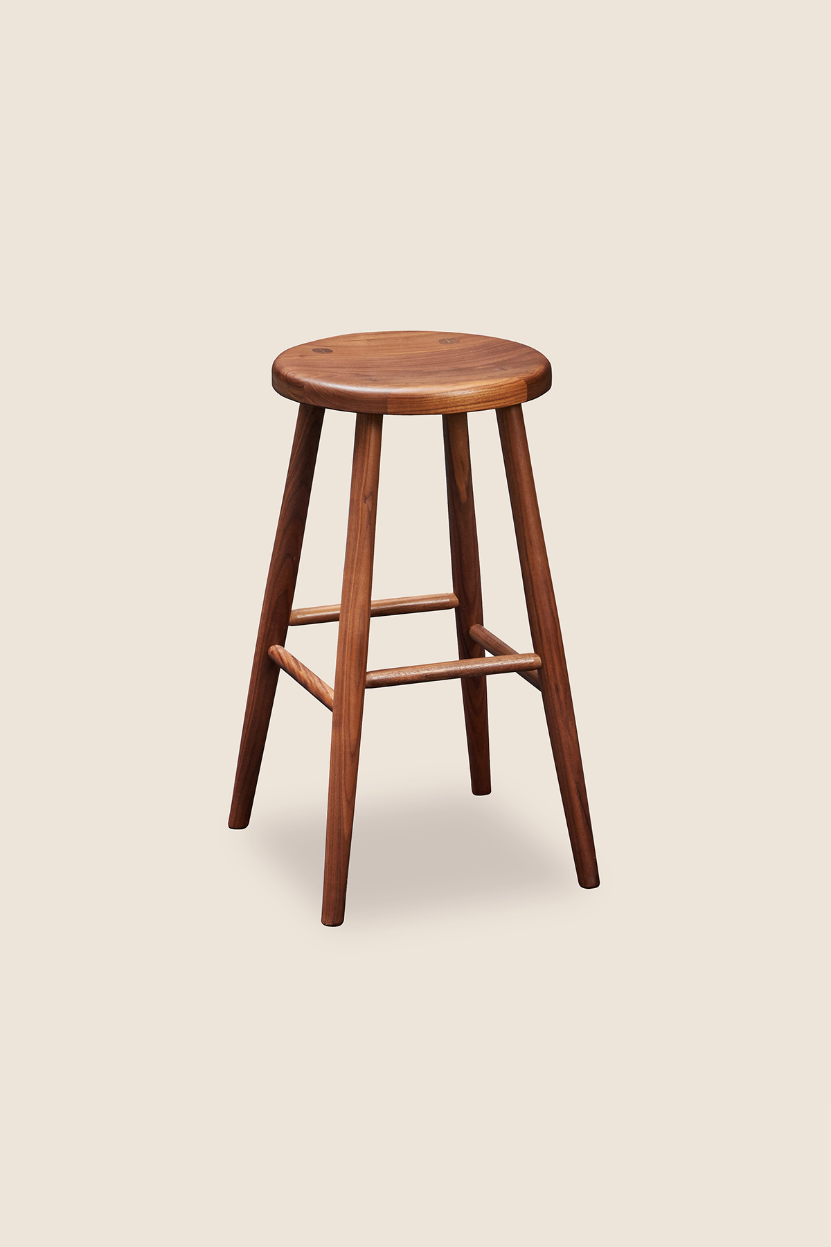 Simple round solid walnut wood stool, from Arkansas's Mazhil & Co. Co.