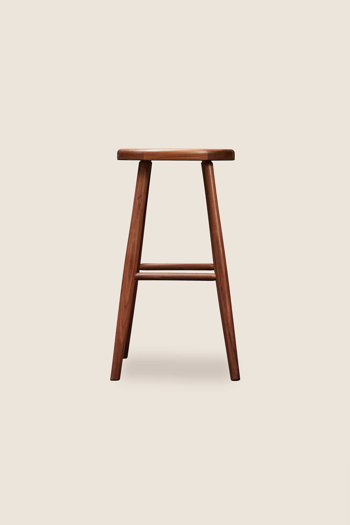 Simple round solid walnut wood stool, from Arkansas's Mazhil & Co. Co.