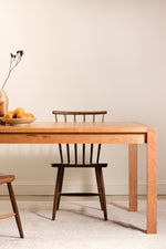 Modern wood Parsons table with finger joints, from Chilton Furniture. Shown with walnut chairs.