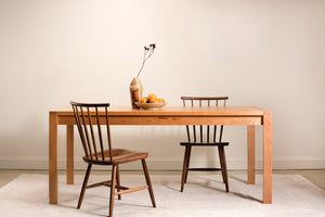 Modern wood Parsons table with finger joints, from Chilton Furniture. Shown with walnut chairs.