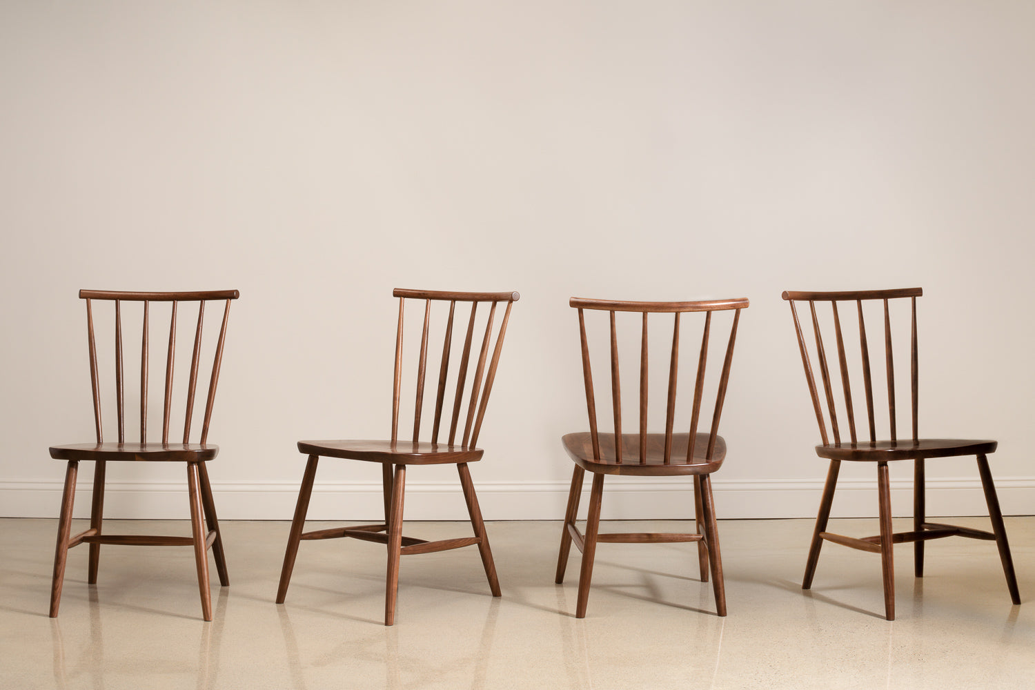 Four walnut Concord chairs shown in every angle