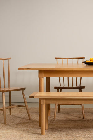 Revelry dining set from Chilton Furniture shown in white oak solid wood with fruit on table