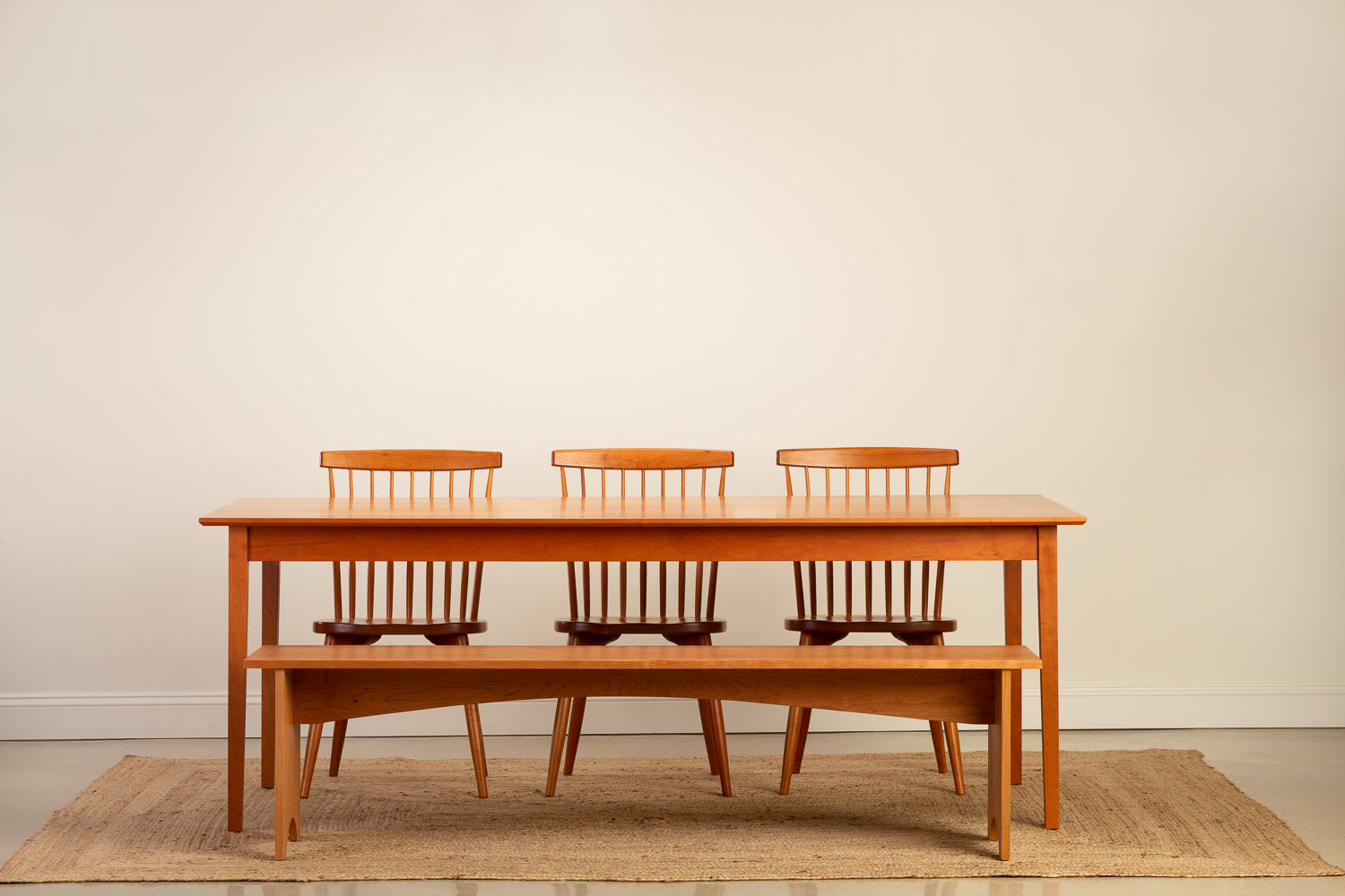 Chilton Furniture's Shaker Dining Table Paired with the Shaker Bench and Chilton Spindle Chairs in solid cherry wood