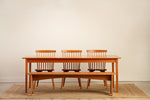 Chilton Furniture's Shaker Dining Table paired with the Shaker Bench and Chilton Spindle Chairs in solid cherry wood