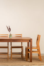 Chilton Furniture's solid walnut wood Harbor Dining Table with Dockside chairs