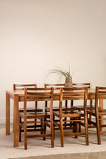Chilton Furniture's solid walnut Dockside chairs with white oak Harbor Dining Table