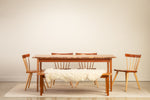 Rustic dining room with Live edge Acadia Dining Table and Bench with Windsor style Boston Chairs, styled with a white sheepskin