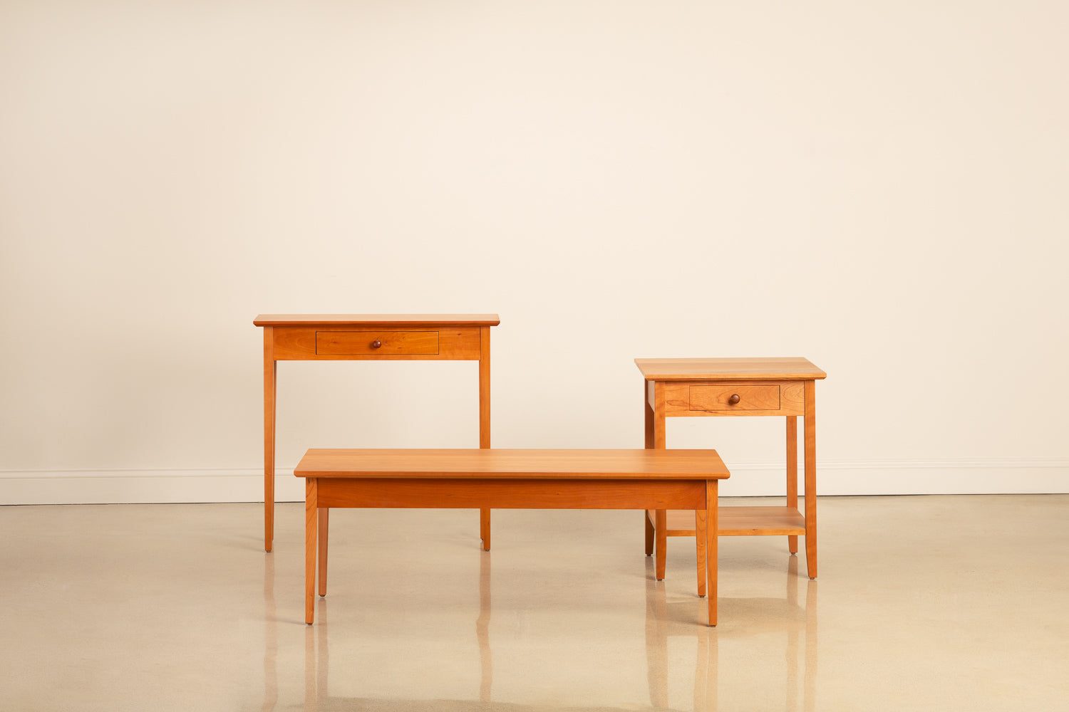 Group of three cherry wood occasional tables from Chilton Furniture in Maine