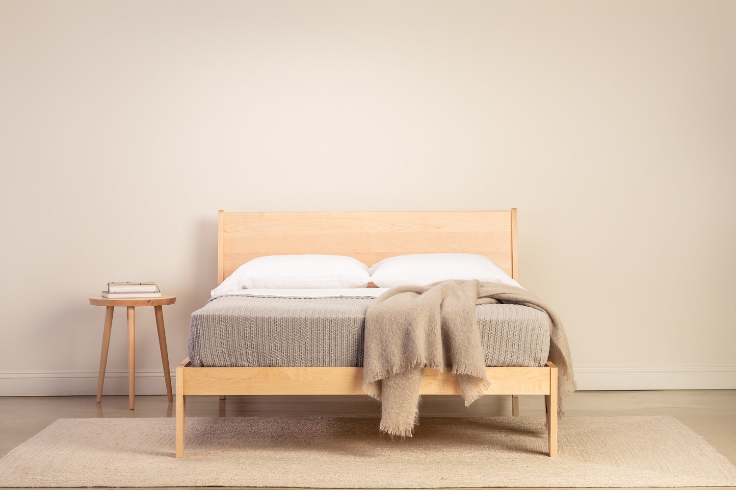 Minimalist bedroom with Mysa Nightstand and Bed in solid maple wood