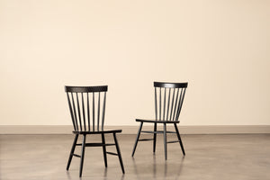 Two harvest spindle chairs painted black