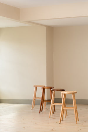 Four round Hancock Stools from Chilton Furniture lined up