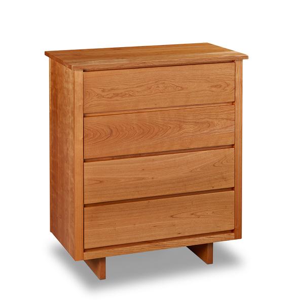 Chilton Furniture's Acadia collection four drawer cherry bedroom chest with under drawer pulls and panel base
