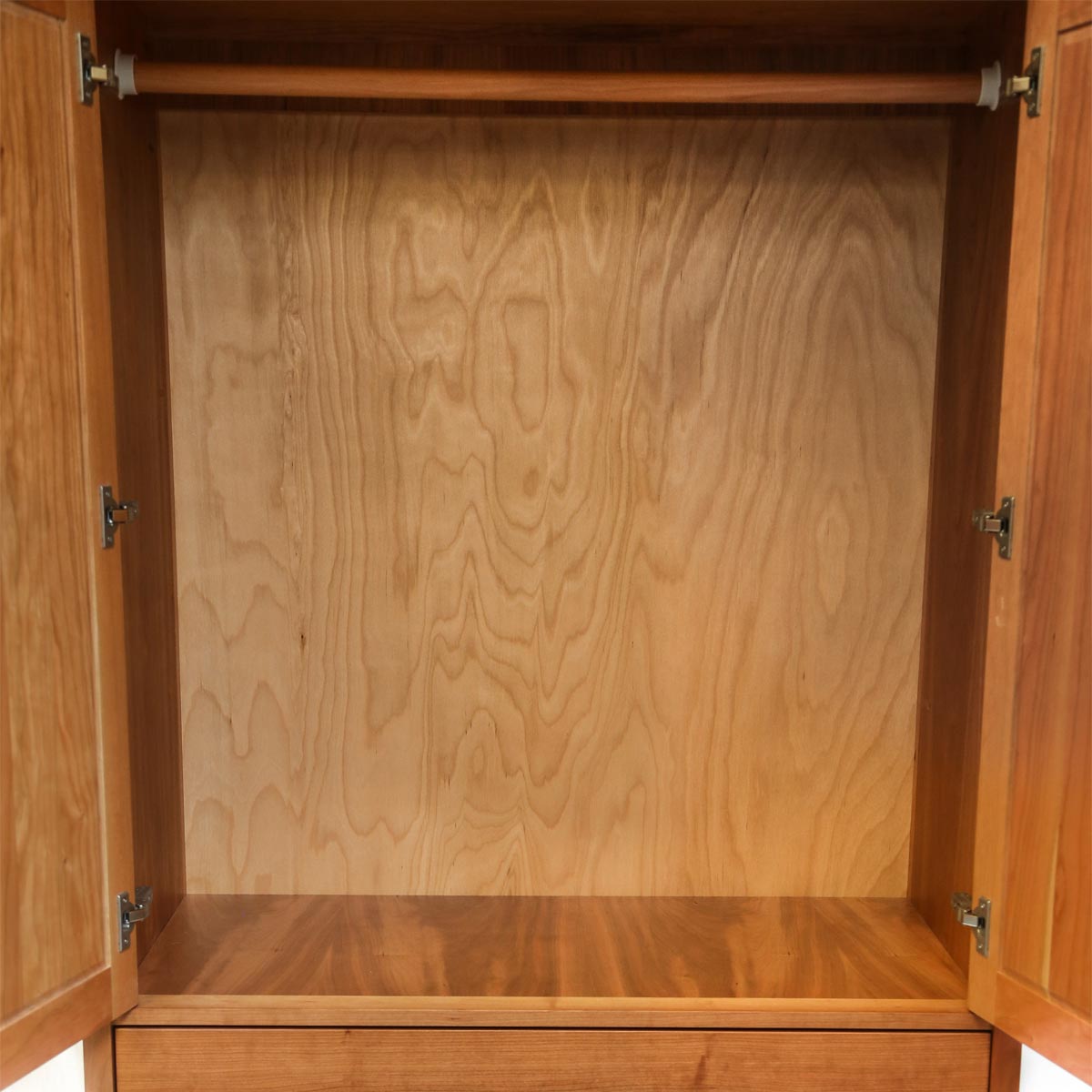 Storage space of classic cherry Shaker wardrobe, from Maine's Chilton Furniture Co. 