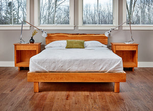 Modern bedroom with two Acadia nightstands and live edge bed in cherry made with white bedding