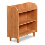 Bookshelf with open top, rounded corners, and round tapered legs, in cherry wood. 