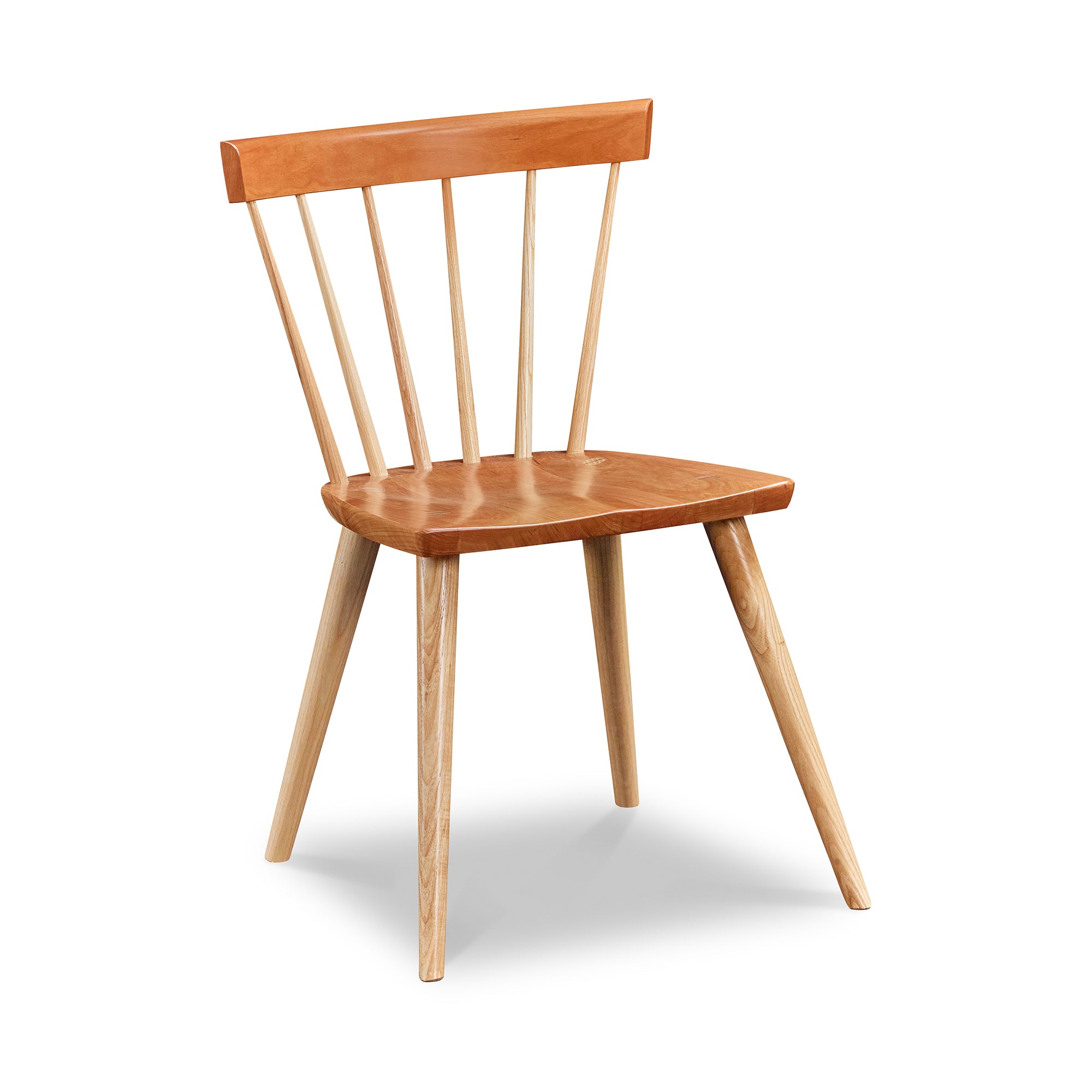 Modern Windsor inspired spindle chair with curved back in cherry and ash