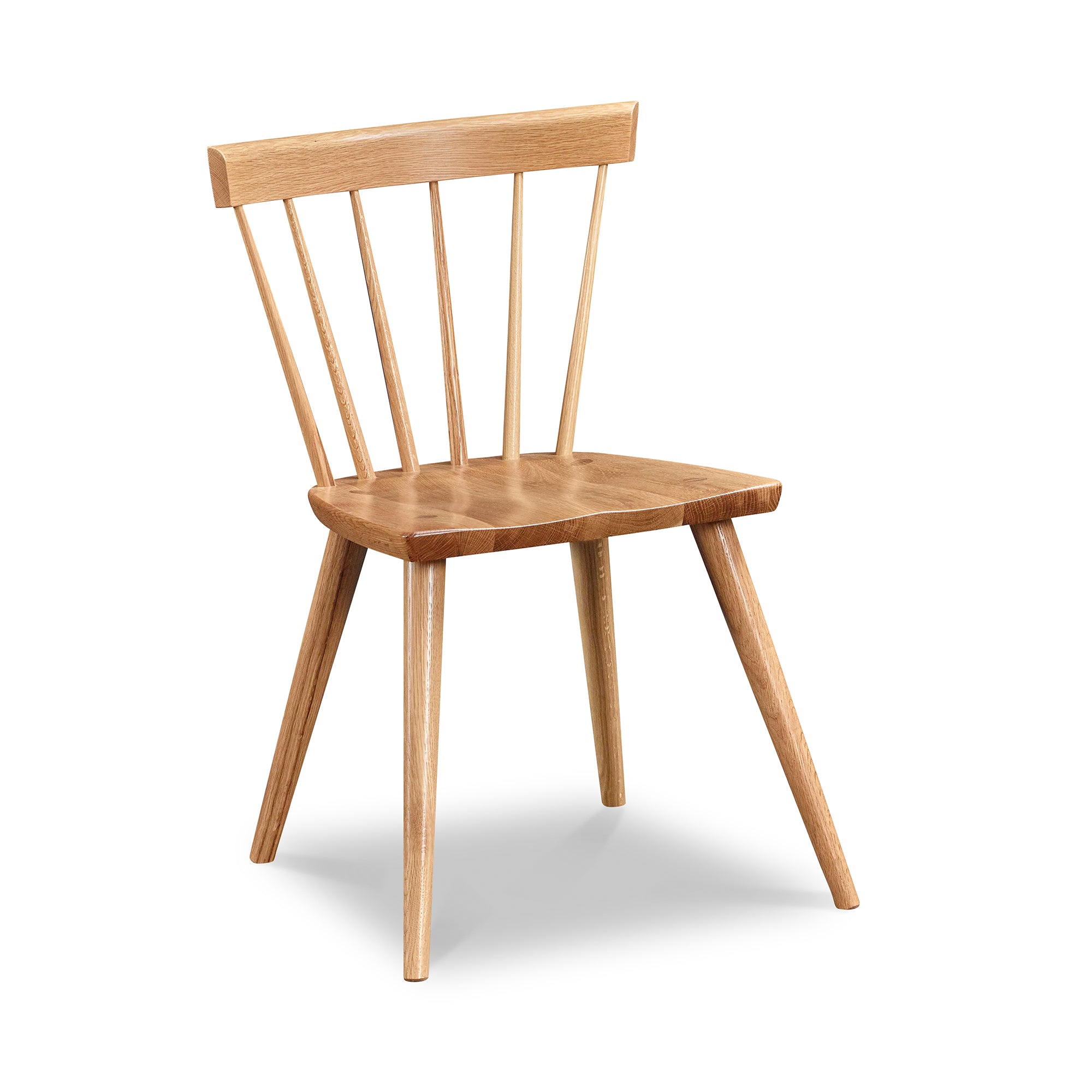 Modern Windsor inspired spindle chair with curved back in white oak