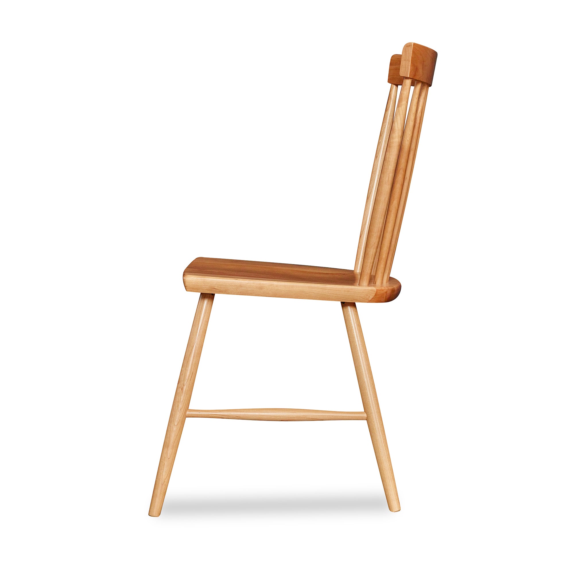 Side view of spindle style dining chair in cherry wood from Chilton Furniture